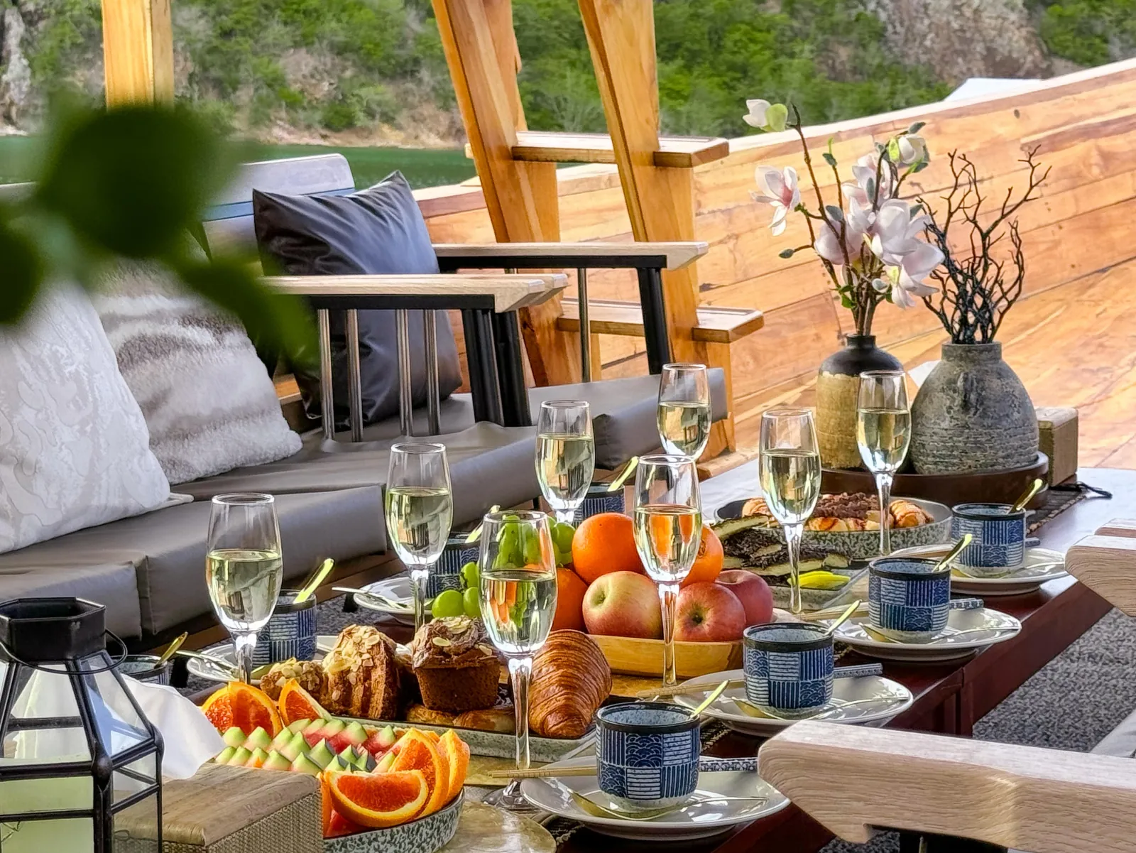 Breakfast and fruit laid out on the boat's deck table